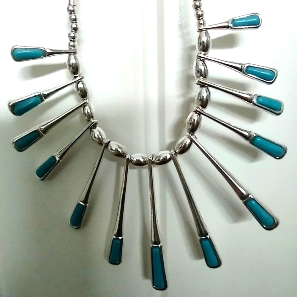Turquoise necklace set in liquid silver